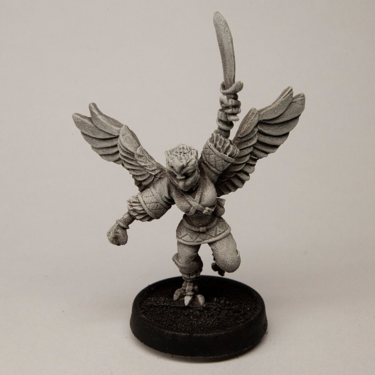 Primed pewter Female Owlfolk Fighter miniature, 51mm tall