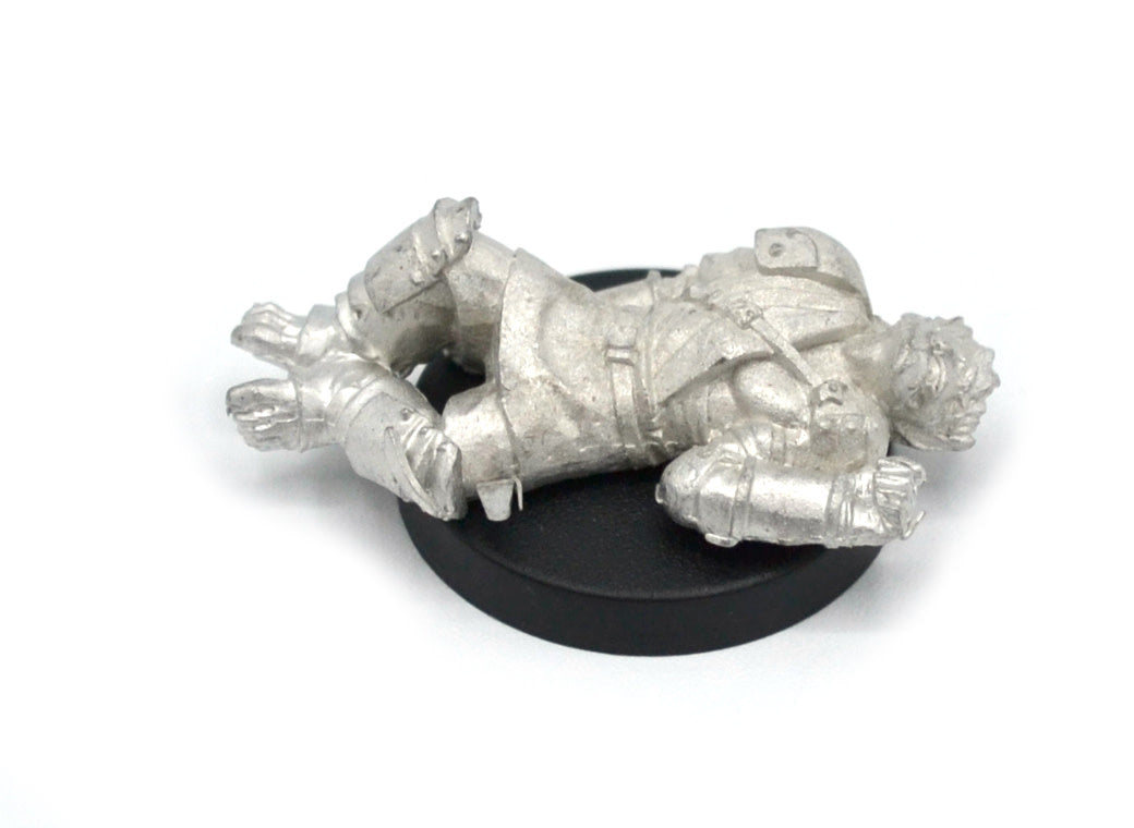 Unpainted pewter Half-Orc Unconscious miniature, 35mm long