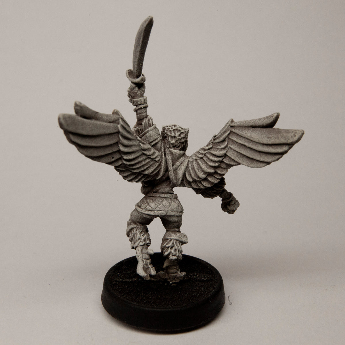 Primed pewter Female Owlfolk Fighter miniature, 51mm tall, another view